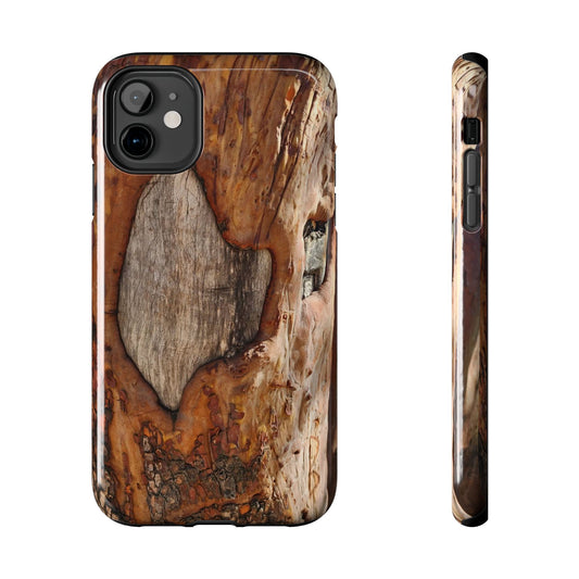 Wooden phone case with natural grain pattern on a white background
